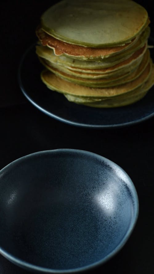 A Person Putting Matcha Powder in a Bowl