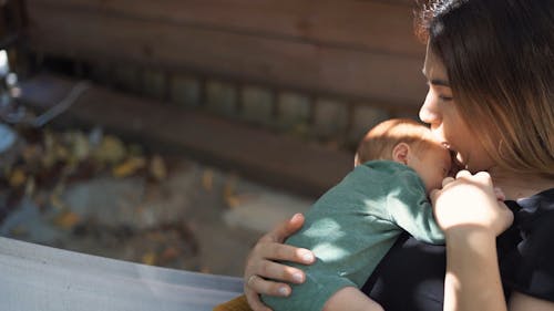 A Mother Kissing Her Baby