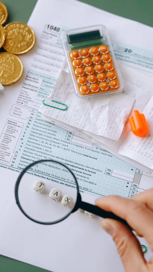 Using a Magnifying Glass In Making Tax Returns