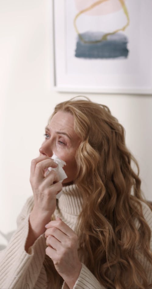 A Woman Getting Teary Eyes From Allergies