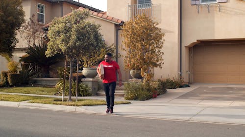 A Man Delivering a Package