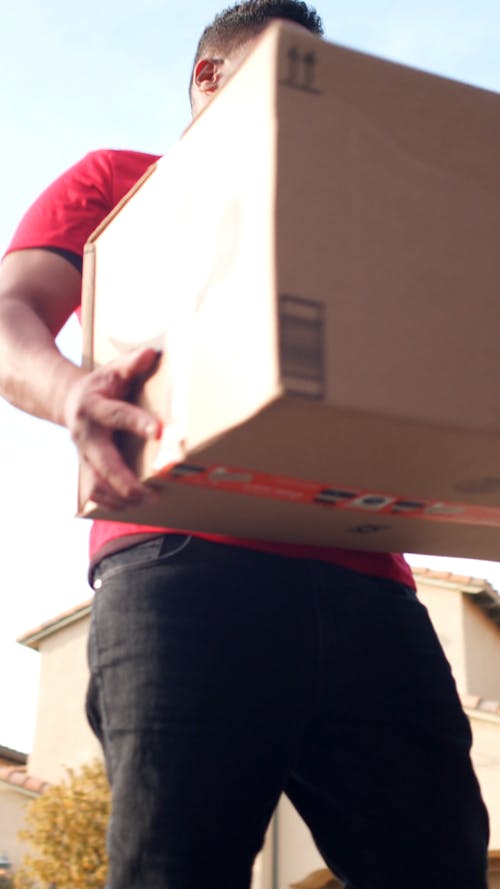 A Delivery Man Carrying a Package