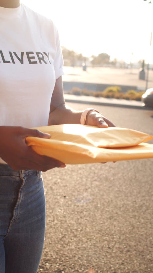 A Person Handing Out a Parcels