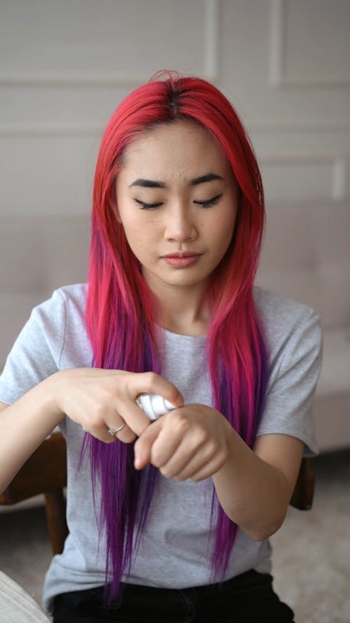 Woman Applying Makeup on her Face