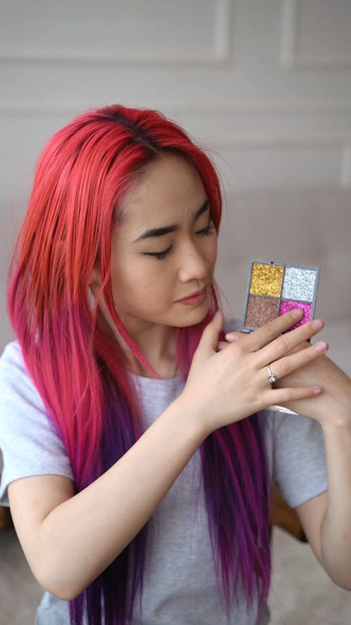 Woman Applying Glitter Eyeshadow