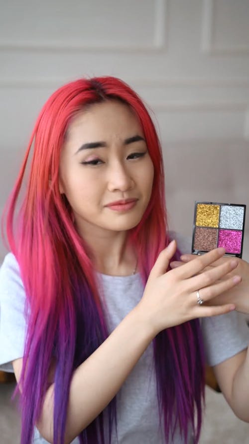 Woman Applying Glitter Eyeshadow