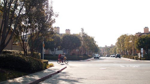 A Delivery Man Riding a Bike