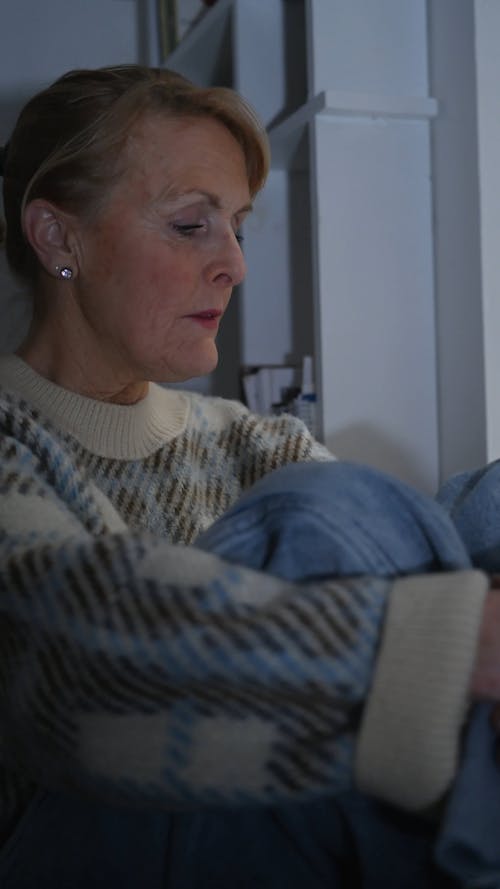 Lonely Elderly Woman Sitting at Home