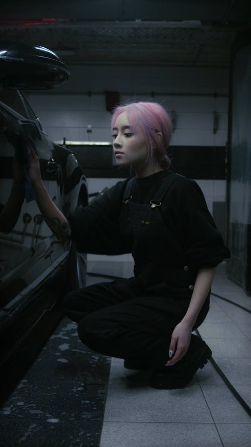 Woman Wiping the Car With Dry Cloth