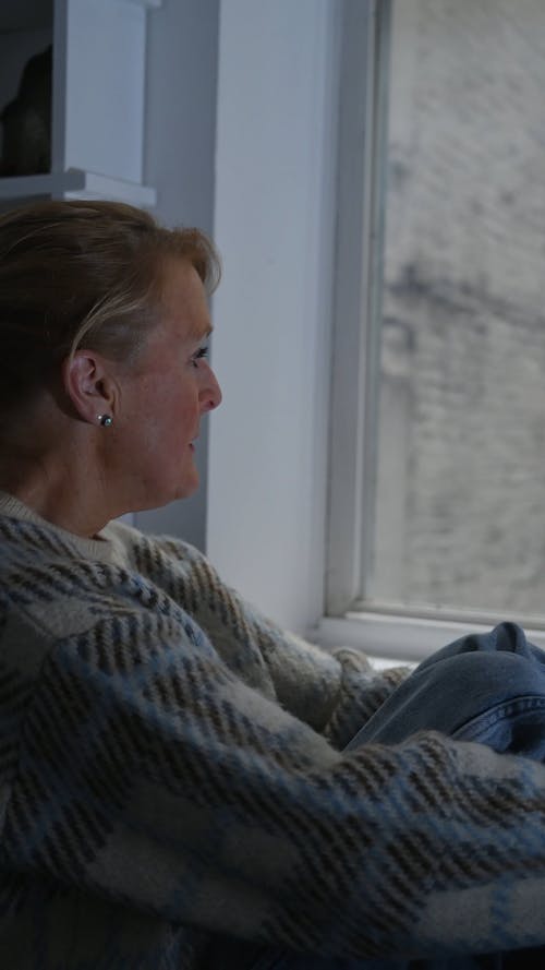 Woman Sitting by the Window