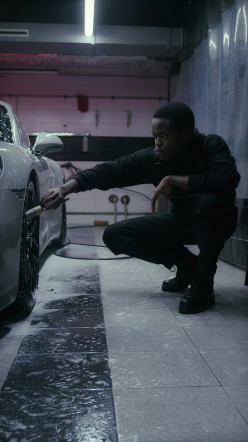 Man Cleaning the Tires