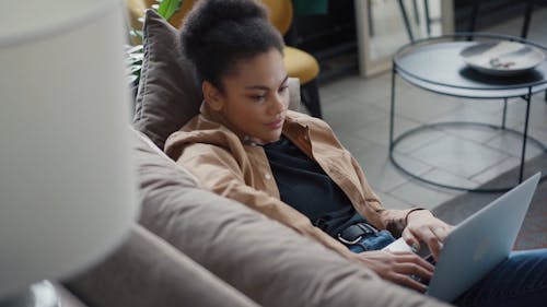 Woman Typing on Her Laptop