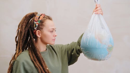 A Woman Holding a Globe