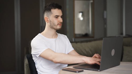 Man Using a Laptop at Home