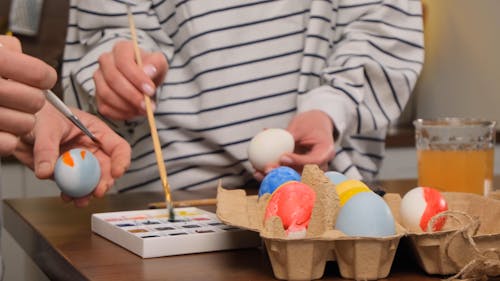 People Painting Easter Eggs