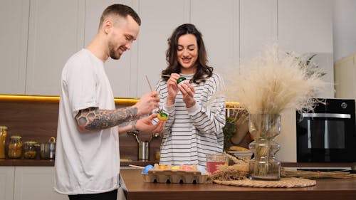 A Couple Painting Easter Eggs