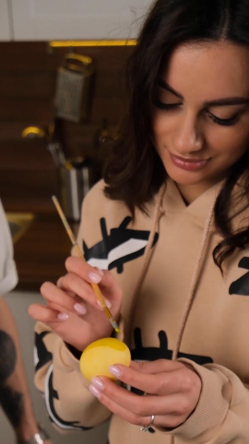 Woman Painting Easter Eggs