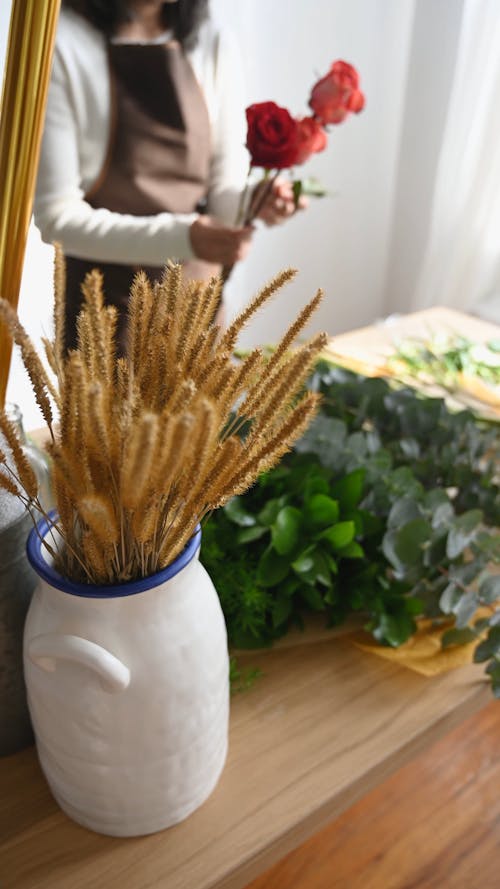 Person Arranging Flowers