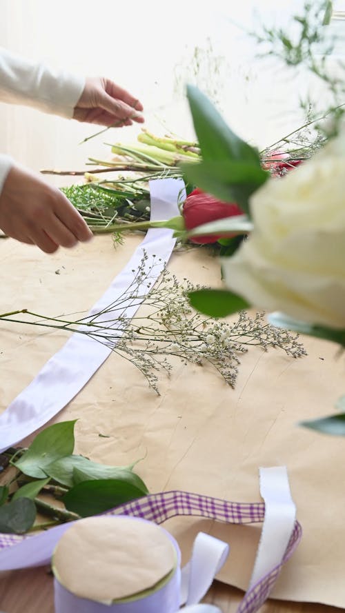 Person Making a Flower Arrangement