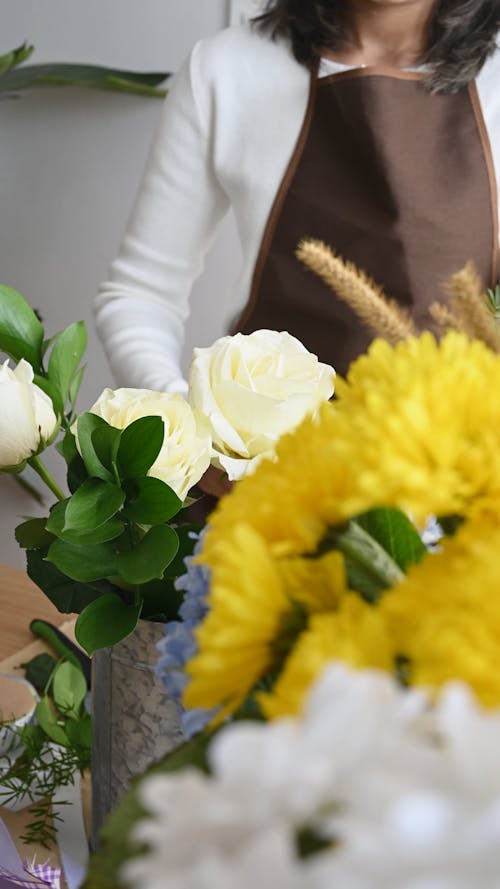 Person Arranging Flowers