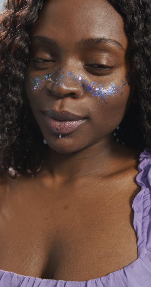 Young Woman With Glitter on Face