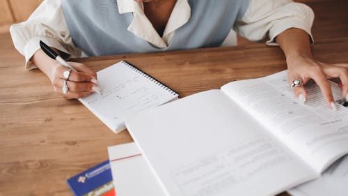 Student Writing in Her Notebook