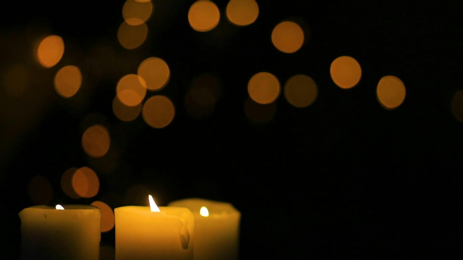 Close-Up View of Lighted Candles in the Dark · Free Stock Video