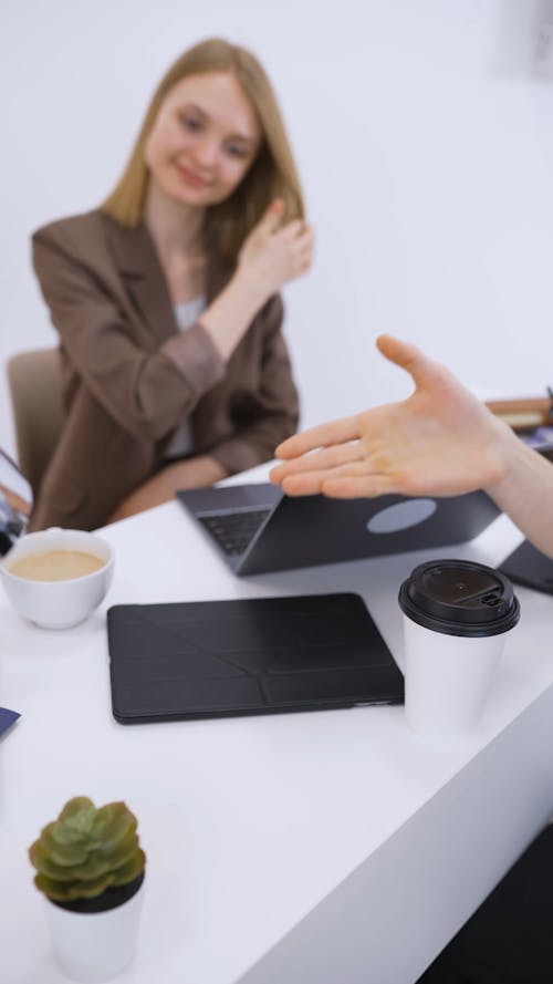 Coworkers Shaking Hands at the Office