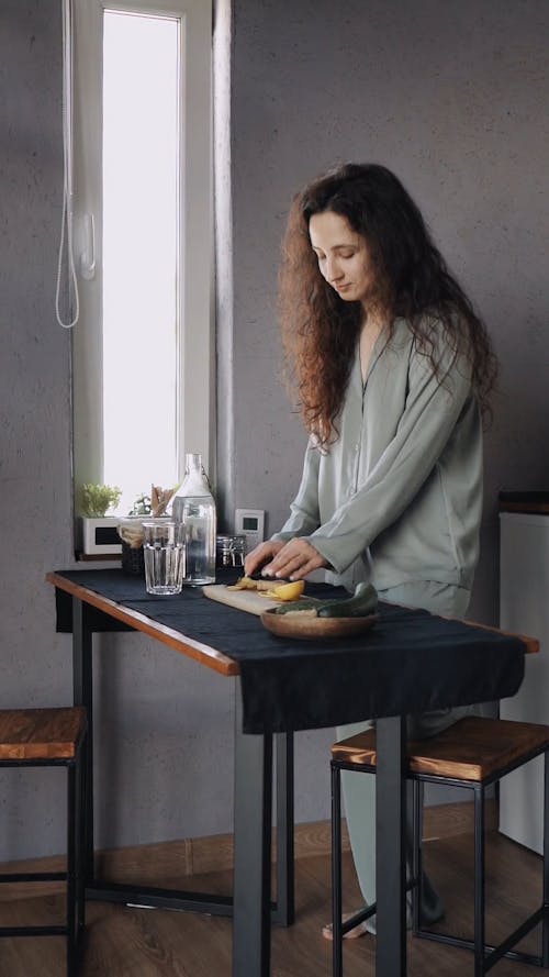 Woman Wearing Sleepwear Preparing Food