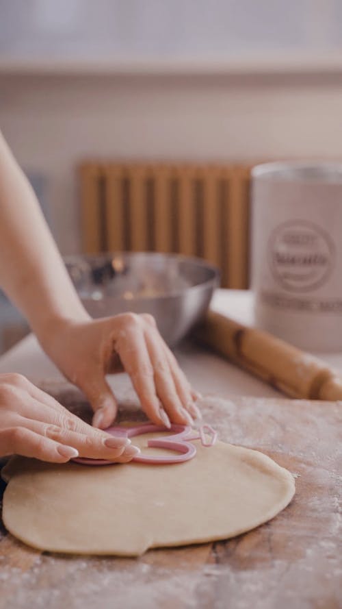 A Woman Using a Cookie Tray