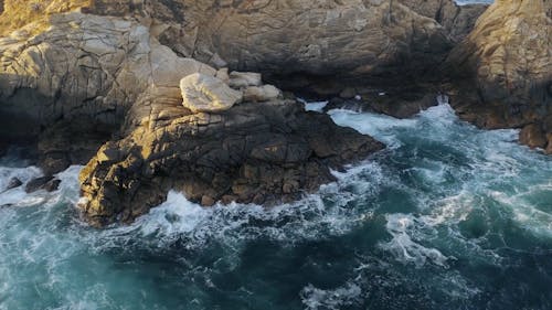 Aerial Footage of Waves Crashing to the Cliffs