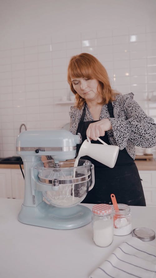 A Woman Mixing Pouring Milk