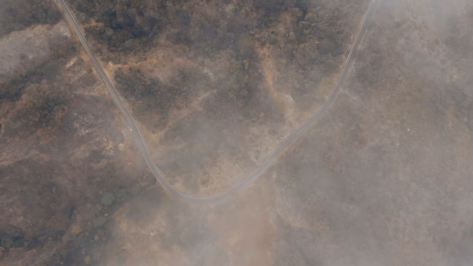 Bird's Eye View Of A Road Between Grass Fields Free Stock Video Footage ...