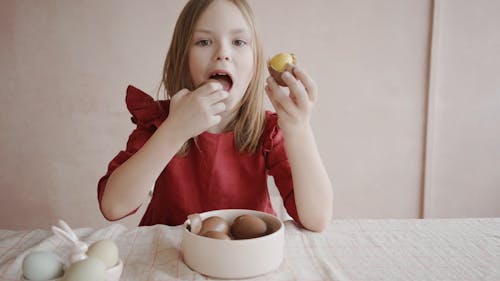 A Girl Eating Eggs