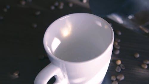 Close Up of Coffee Being Poured into Cup