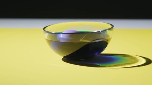 Reflection of the Egg Color in Clear Glass Bowl