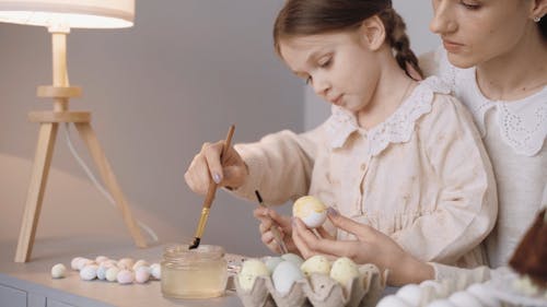Mother and Daughter Painting Eggs
