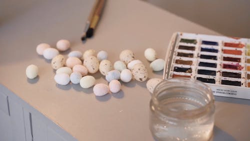 A Video of Easter Egg Painting Materials and Cake