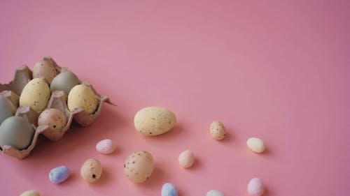 Pastel Colored Eggs on Pink Background