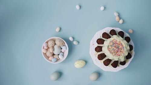 An Overhead Shot of Colored Eggs Rolling 