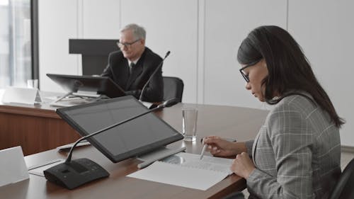 Business People Sitting in a Conference Room