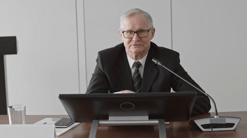 A Man Talking in A Conference