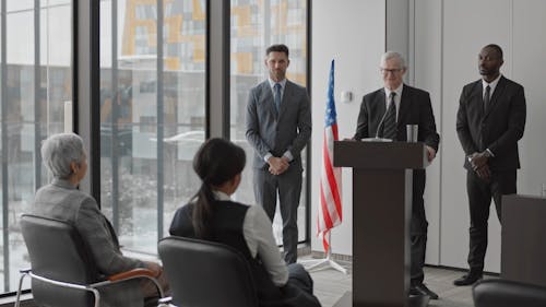 Elderly Man Talking at the Podium