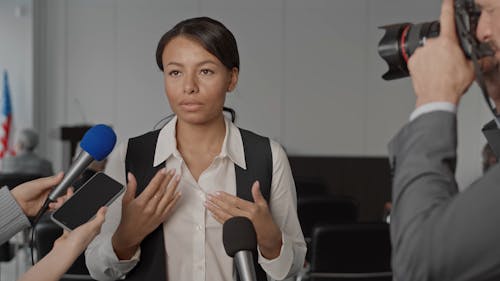 Woman Talking to the Press