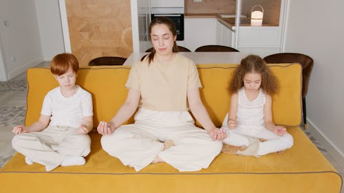 Mother and Children Meditating
