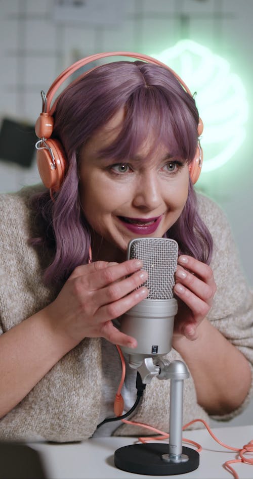 A Woman Whispering on a Condenser Microphone