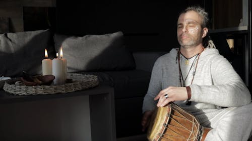 Man Playing Hand Drums