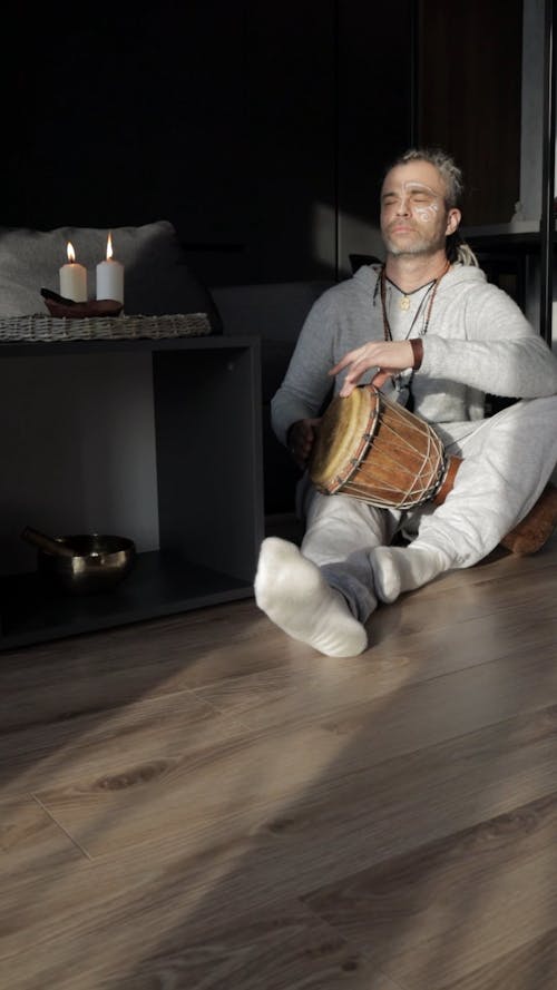 Man Playing Hand Drums