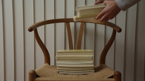 Books Stacked on a Chair