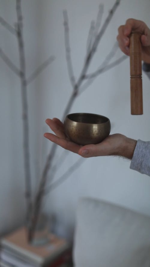 A Person Holding Singing Bowl